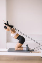 Load image into Gallery viewer, Improving Posture on a Pilate Reformer in Yoga Senses Causeway Bay