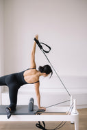 Performing a Side Plank during Core Pilate Workout with Joanne Wu